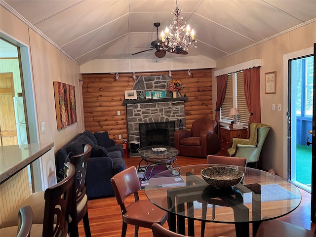 23 N Seminole Trl, Bethel, NY 12778 - living room with rustic walls, wood finished floors, ornamental molding, a fireplace, and a ceiling fan