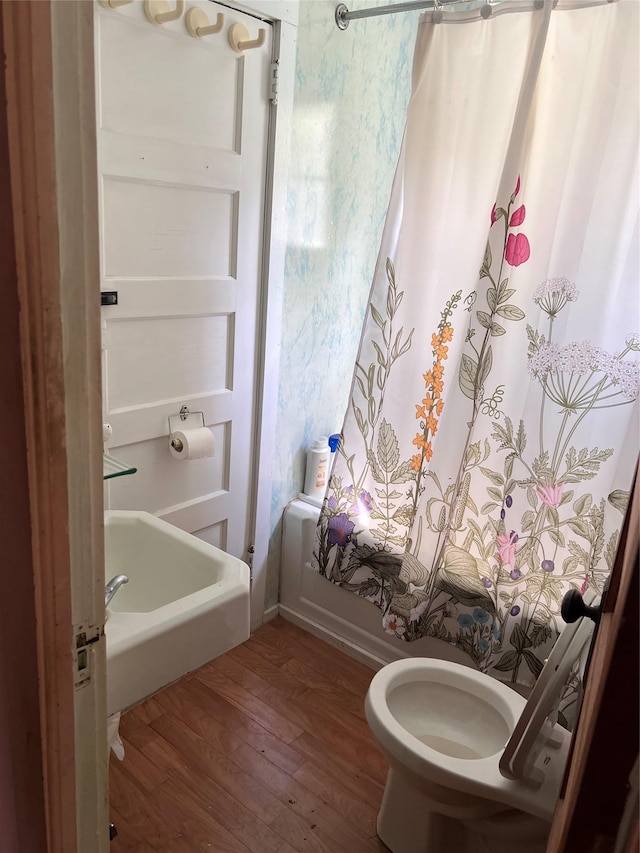 23 N Seminole Trl, Bethel, NY 12778 - bathroom featuring wood finished floors and shower / bath combo with shower curtain