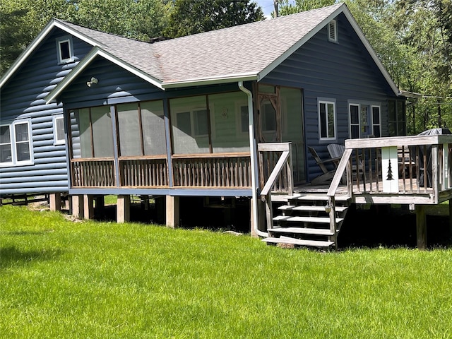 23 N Seminole Trl, Bethel, NY 12778 - rear view of property with roof with shingles, a wooden deck, a lawn, and a sunroom
