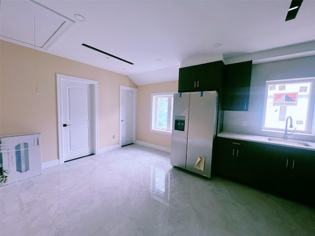 208-04 47th Ave, Bayside, NY 11361 - kitchen featuring stainless steel fridge, a sink, vaulted ceiling, light countertops, and baseboards