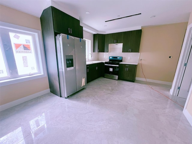 208-04 47th Ave, Bayside, NY 11361 - kitchen featuring stove, green cabinets, stainless steel refrigerator with ice dispenser, light countertops, and baseboards