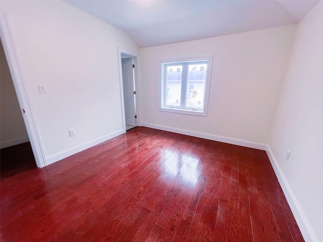 208-04 47th Ave, Bayside, NY 11361 - spare room with dark wood-style flooring, lofted ceiling, and baseboards