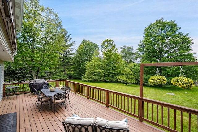 2 Shoshone Dr, Katonah, NY 10536 - deck with outdoor dining area, a yard, and a grill