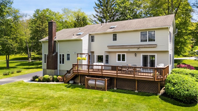 2 Shoshone Dr, Katonah, NY 10536 - rear view of property with a deck, a lawn, and a chimney