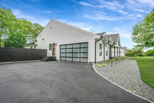 57 Varsity Blvd, East Setauket, NY 11733 - view of side of property featuring an attached garage and driveway
