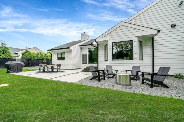 57 Varsity Blvd, East Setauket, NY 11733 - rear view of house featuring a chimney and a patio area