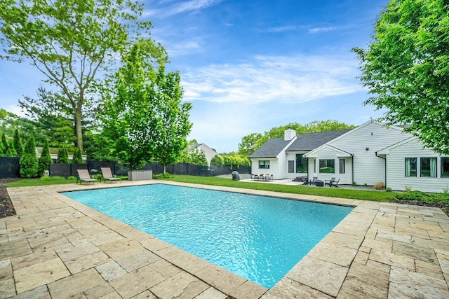 57 Varsity Blvd, East Setauket, NY 11733 - view of swimming pool featuring a patio and a fenced backyard