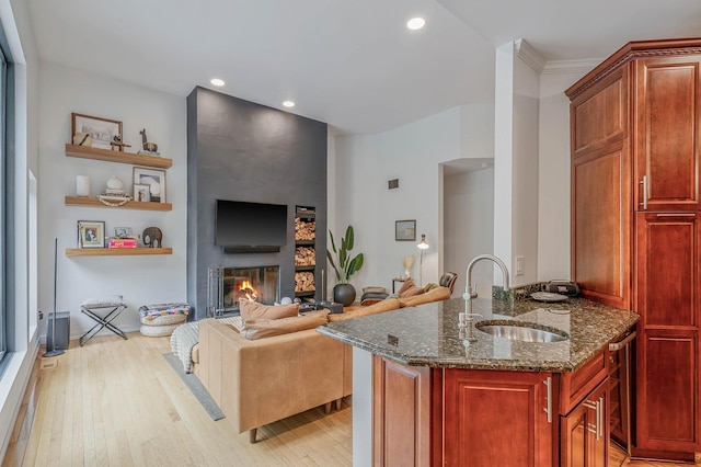 57 Varsity Blvd, East Setauket, NY 11733 - living area with light wood-style floors, a glass covered fireplace, and recessed lighting