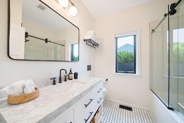 57 Varsity Blvd, East Setauket, NY 11733 - bathroom with vanity, baseboards, toilet, and bath / shower combo with glass door