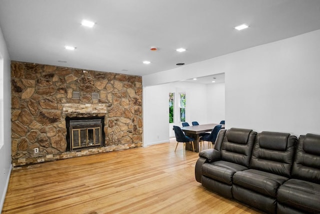 7 Lake St, Monticello, NY 12701 - living room with light wood finished floors, a stone fireplace, and recessed lighting