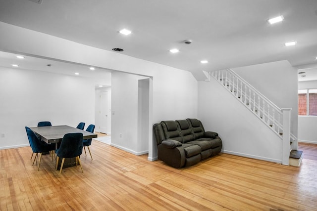 7 Lake St, Monticello, NY 12701 - dining room with light wood-type flooring, stairway, baseboards, and recessed lighting