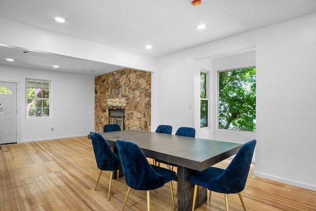 7 Lake St, Monticello, NY 12701 - dining space with light wood finished floors, a fireplace, baseboards, and recessed lighting