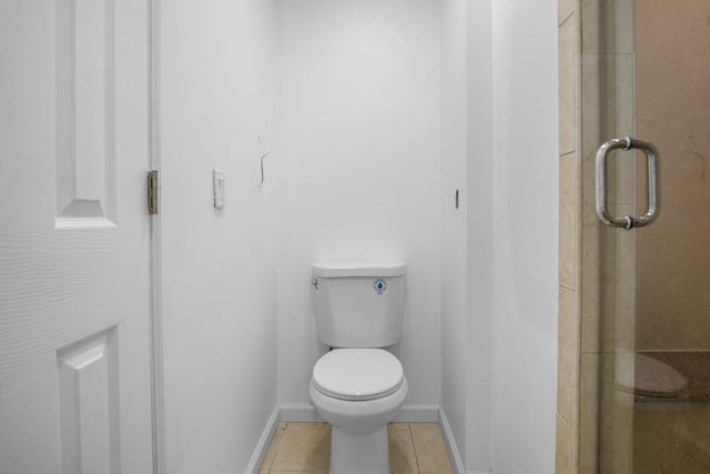 7 Lake St, Monticello, NY 12701 - full bathroom featuring toilet, a shower stall, tile patterned flooring, and baseboards