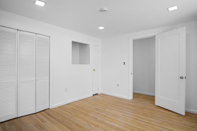 7 Lake St, Monticello, NY 12701 - unfurnished bedroom with light wood finished floors and baseboards