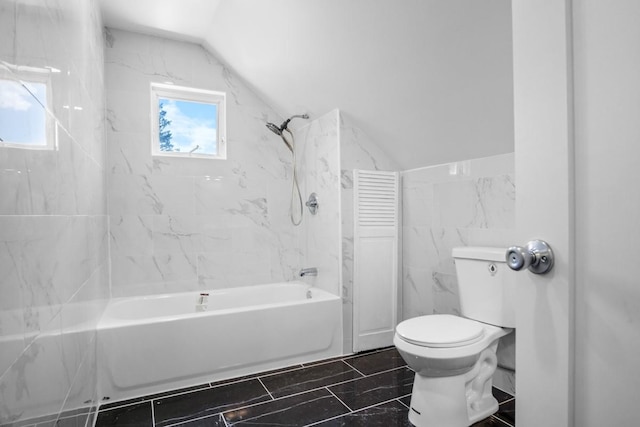 7 Lake St, Monticello, NY 12701 - bathroom featuring bathtub / shower combination, toilet, lofted ceiling, and tile walls