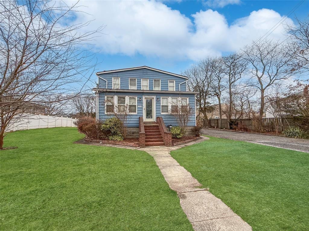 600 Little E Neck Rd, West Babylon, NY 11704 - view of front of home featuring gravel driveway