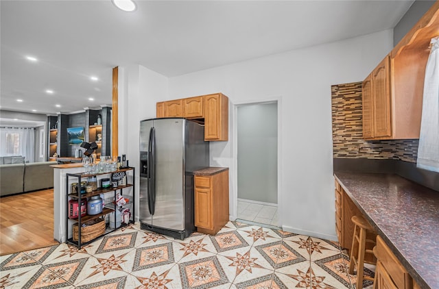 102-13 85th Ave, Richmond Hill, NY 11418 - kitchen featuring stainless steel fridge with ice dispenser, backsplash, open floor plan, recessed lighting, and baseboards