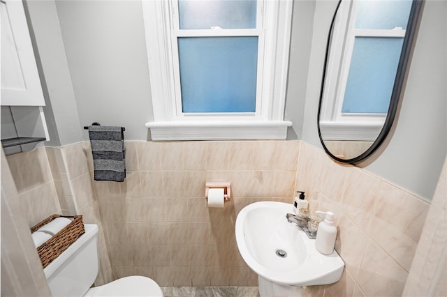 102-13 85th Ave, Richmond Hill, NY 11418 - bathroom featuring tile walls, toilet, a sink, and a wainscoted wall