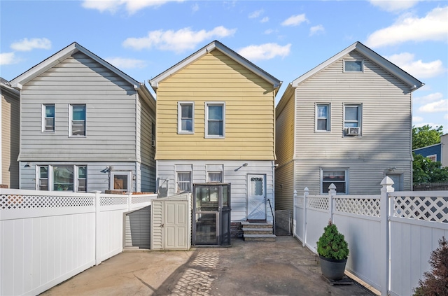 102-13 85th Ave, Richmond Hill, NY 11418 - rear view of property with a fenced backyard and cooling unit