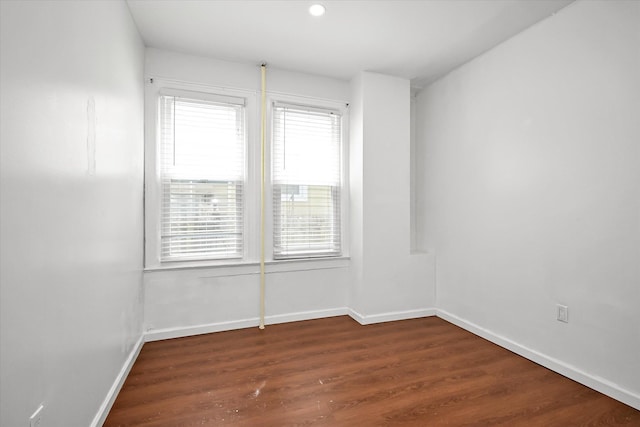27-34 Mcintosh St, East Elmhurst, NY 11369 - unfurnished room featuring plenty of natural light, baseboards, wood finished floors, and recessed lighting