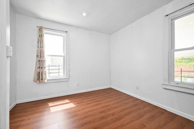 27-34 Mcintosh St, East Elmhurst, NY 11369 - empty room with wood finished floors, baseboards, and recessed lighting