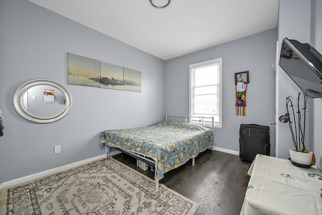 27-34 Mcintosh St, East Elmhurst, NY 11369 - bedroom featuring baseboards and dark wood-style floors