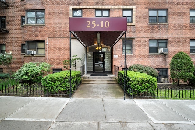 25-10 31st Ave Unit 2M, Astoria, NY 11106 - view of exterior entry with brick siding and cooling unit