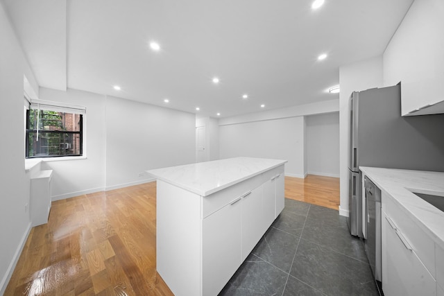 25-10 31st Ave Unit 2M, Astoria, NY 11106 - kitchen featuring a center island, white cabinetry, modern cabinets, recessed lighting, and baseboards