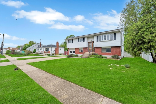 65 Cedar Ct, Copiague, NY 11726 - raised ranch featuring brick siding, concrete driveway, and a residential view