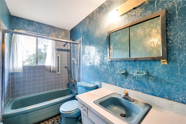 65 Cedar Ct, Copiague, NY 11726 - bathroom featuring toilet, vanity, shower / bath combination, and wallpapered walls