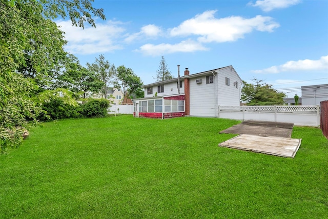 65 Cedar Ct, Copiague, NY 11726 - view of yard featuring a patio area