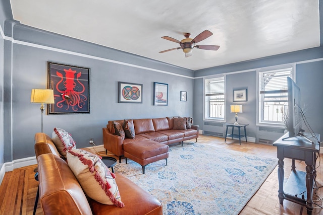 35-05 72nd St Unit 6F, Jackson Heights, NY 11372 - living area featuring baseboards, ceiling fan, and radiator