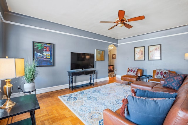 35-05 72nd St Unit 6F, Jackson Heights, NY 11372 - living area featuring a ceiling fan, baseboards, and arched walkways