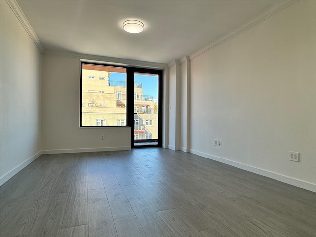 132-27 41st Rd Unit 7E, Flushing, NY 11355 - empty room featuring ornamental molding, dark wood finished floors, and baseboards