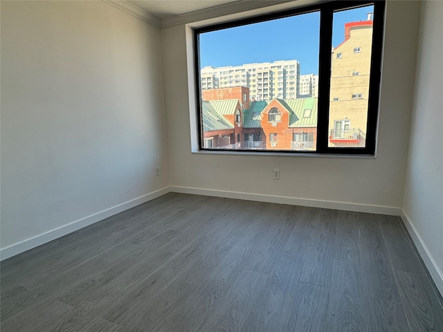 132-27 41st Rd Unit 7E, Flushing, NY 11355 - spare room with plenty of natural light, crown molding, dark wood-style floors, and baseboards