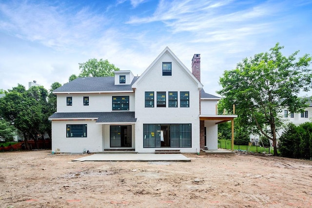 6 Dorchester Ln, Call Listing Agent, CT 06878 - view of front of home featuring a patio, roof with shingles, and a chimney