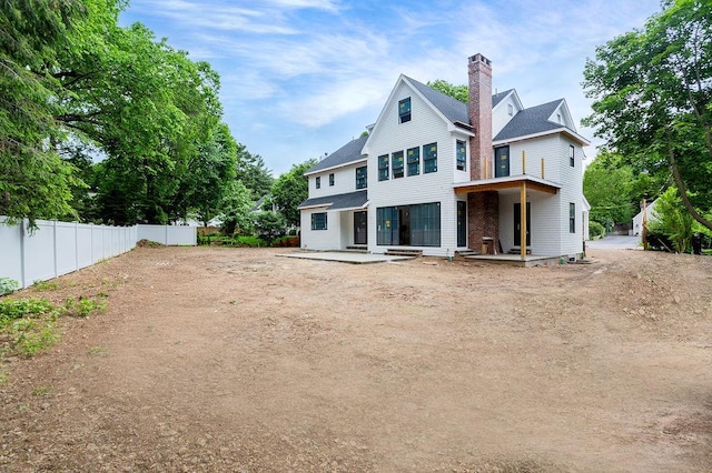 6 Dorchester Ln, Call Listing Agent, CT 06878 - rear view of property with a chimney