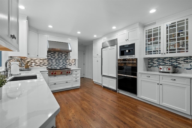 6 Ogden Rd, Scarsdale, NY 10583 - kitchen featuring ventilation hood, stainless steel gas stovetop, paneled fridge, a sink, and tasteful backsplash