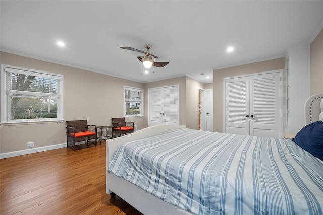 6 Ogden Rd, Scarsdale, NY 10583 - bedroom featuring two closets, wood finished floors, baseboards, ornamental molding, and recessed lighting