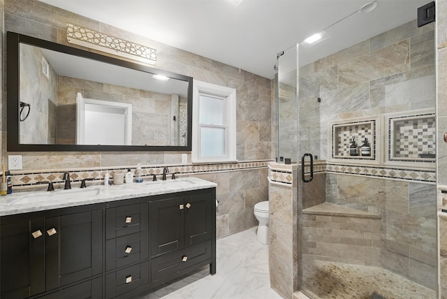 6 Ogden Rd, Scarsdale, NY 10583 - bathroom with tile walls, double vanity, a shower stall, toilet, and marble finish floors