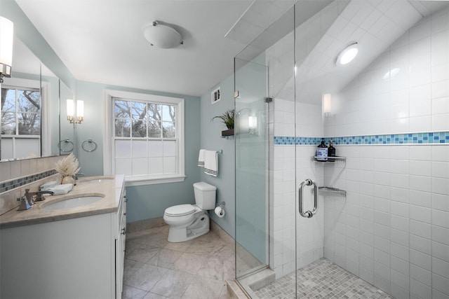6 Ogden Rd, Scarsdale, NY 10583 - full bathroom featuring double vanity, a shower stall, baseboards, toilet, and plenty of natural light