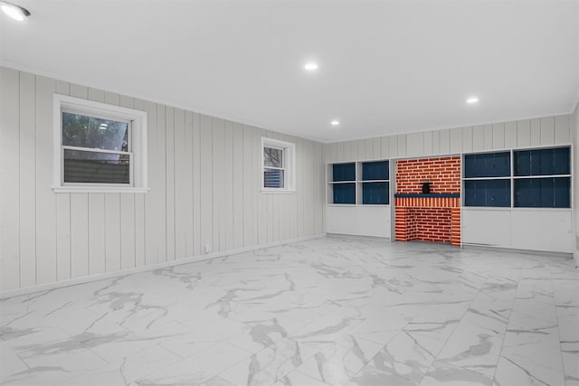 6 Ogden Rd, Scarsdale, NY 10583 - unfurnished living room with recessed lighting, ornamental molding, marble look tile flooring, and wooden walls