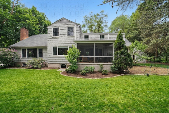 6 Ogden Rd, Scarsdale, NY 10583 - back of property with a yard, a chimney, a sunroom, and a shingled roof