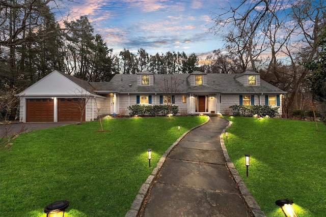 6 Ogden Rd, Scarsdale, NY 10583 - view of front facade with asphalt driveway, a garage, and a lawn