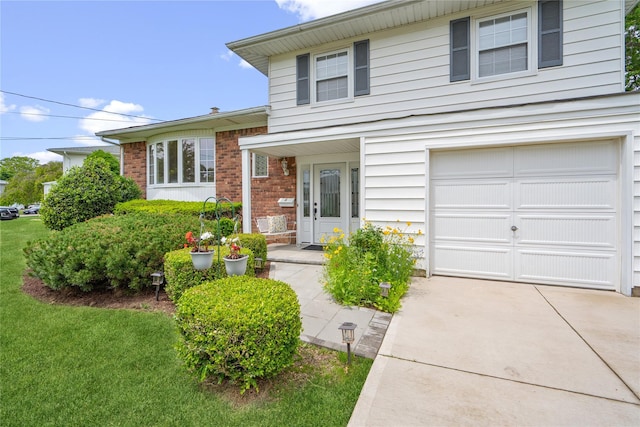 6 Poppy Dr, Massapequa Park, NY 11762 - tri-level home with driveway, an attached garage, brick siding, and a front lawn