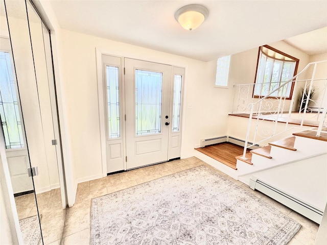 6 Poppy Dr, Massapequa Park, NY 11762 - tiled foyer entrance with a baseboard heating unit, stairs, healthy amount of natural light, and baseboards