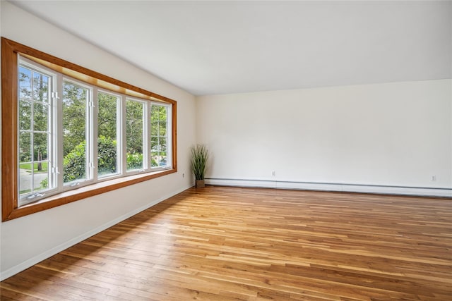6 Poppy Dr, Massapequa Park, NY 11762 - unfurnished room featuring light wood finished floors, baseboards, and a baseboard radiator