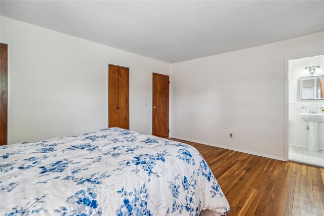 6 Poppy Dr, Massapequa Park, NY 11762 - bedroom featuring hardwood / wood-style flooring, baseboards, and ensuite bathroom