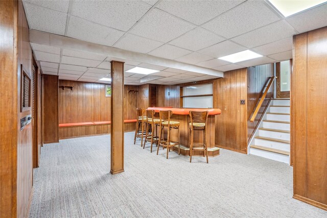 6 Poppy Dr, Massapequa Park, NY 11762 - indoor dry bar with carpet floors, wood walls, a paneled ceiling, and stairway