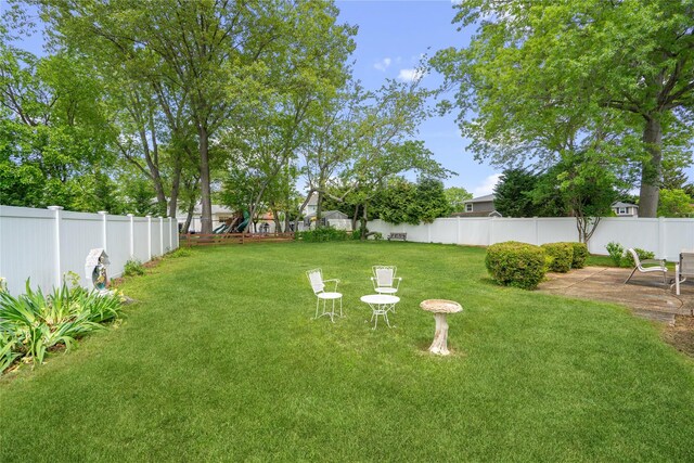 6 Poppy Dr, Massapequa Park, NY 11762 - view of yard featuring a playground and a patio
